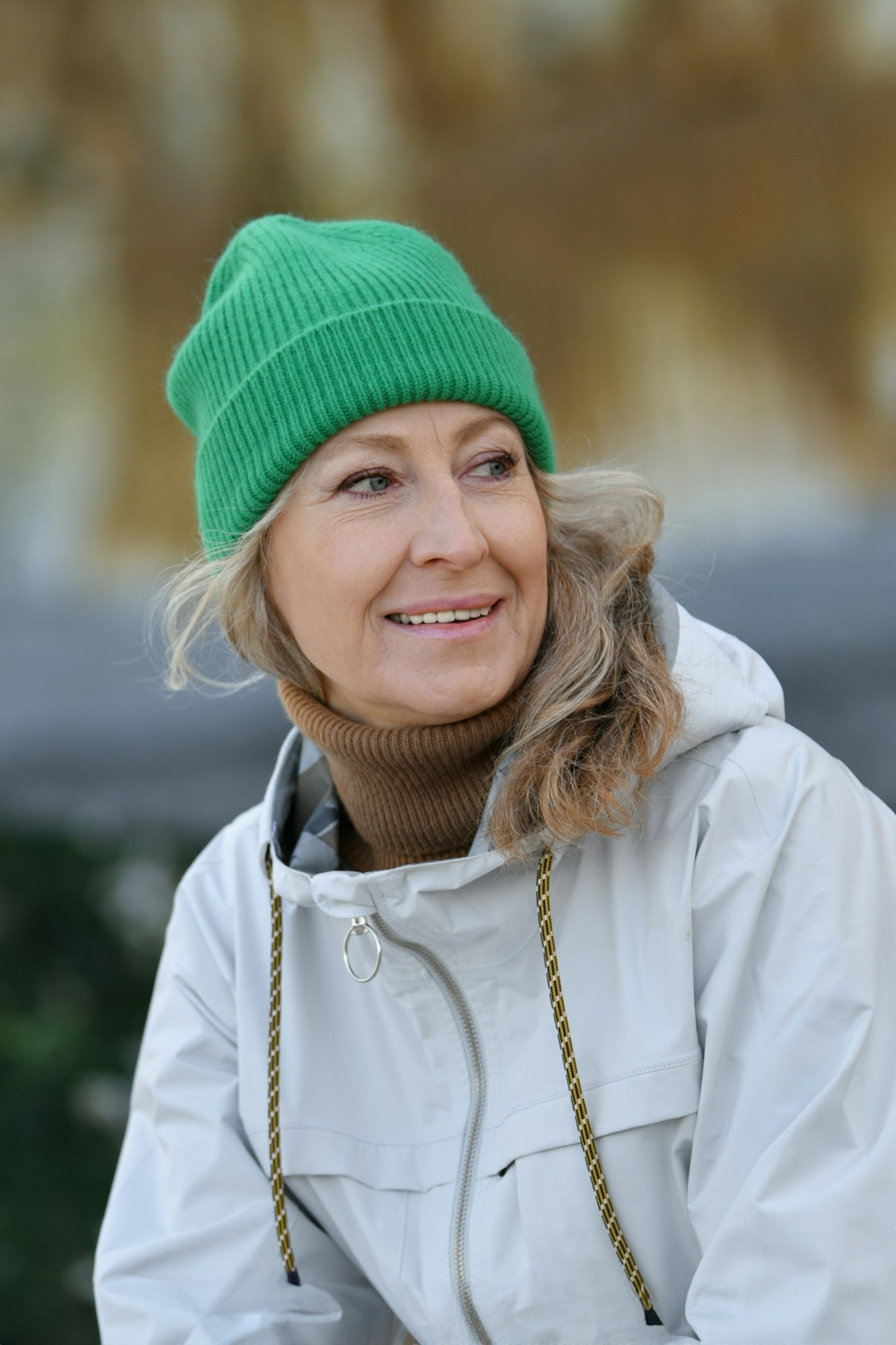 Portrait of a fifty-year-old woman with a snow-white smile