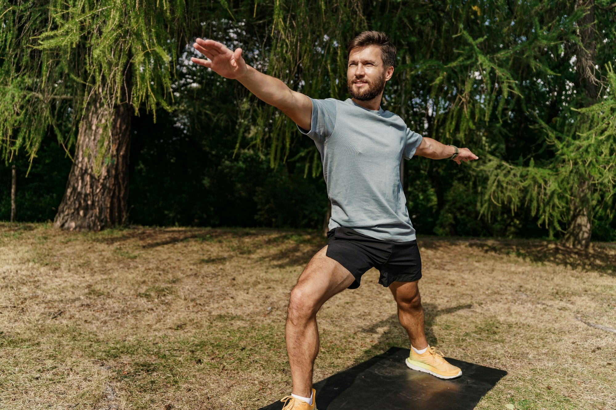 Yoga man is engaged in fitness uses a mat. Motivation and mental health of an athlete. Training man